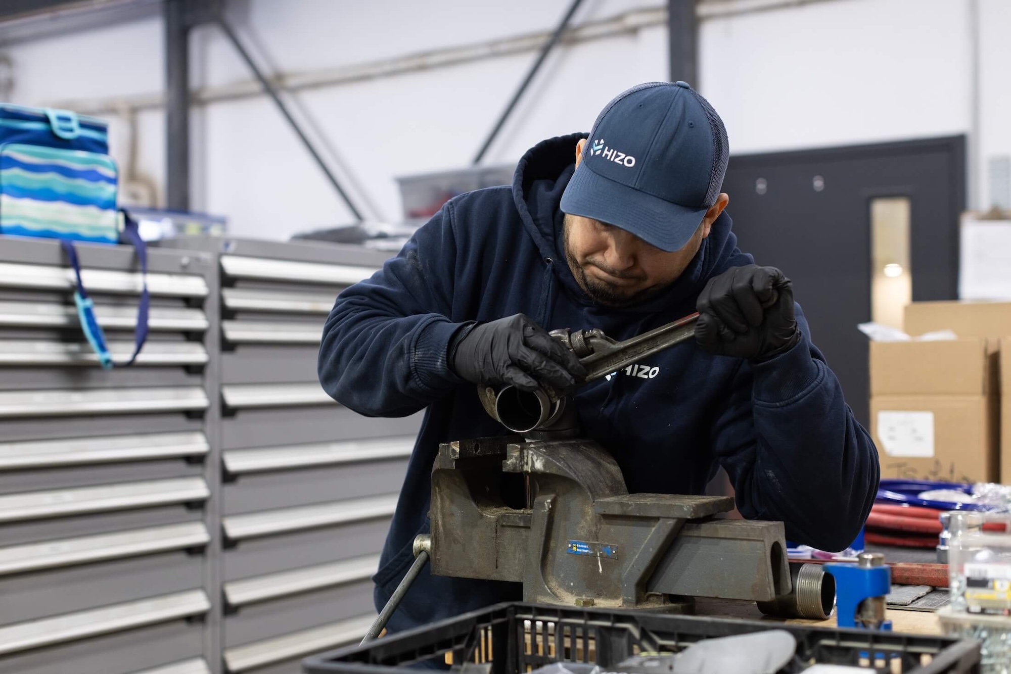 HIZO technician assembling spray gun